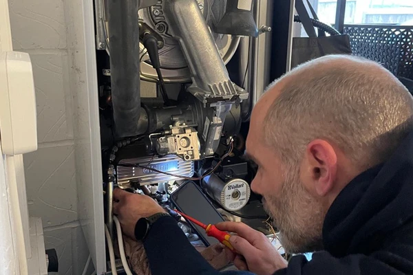 Gas Boiler Service Norfolk - Smart Heating EA Engineer working on a gas boiler